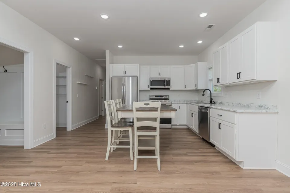 Kitchen with oversized pantry and modern finishes at 111 Hampton Ct